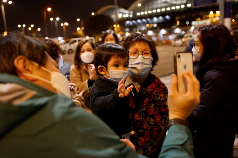 The Wider Image: Leaving Hong Kong: A family makes a wrenching decision