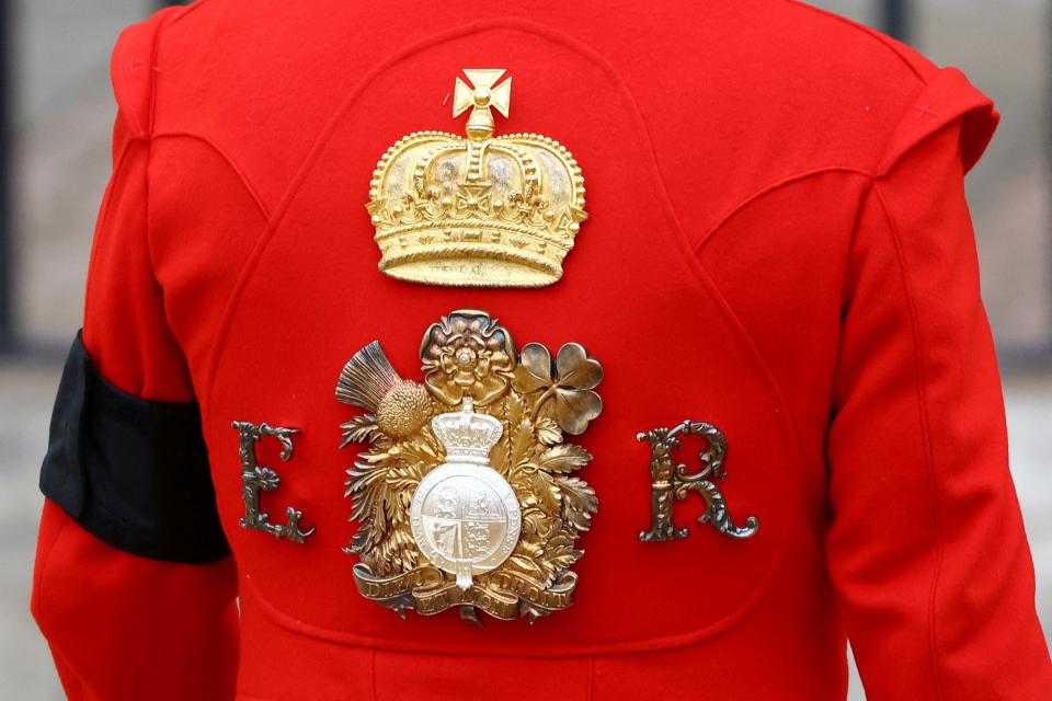 A royal guard stands at Westminster Abbey on the day of the Queen Elizabeth II funeral, London Monday, Sept. 19, 2022.