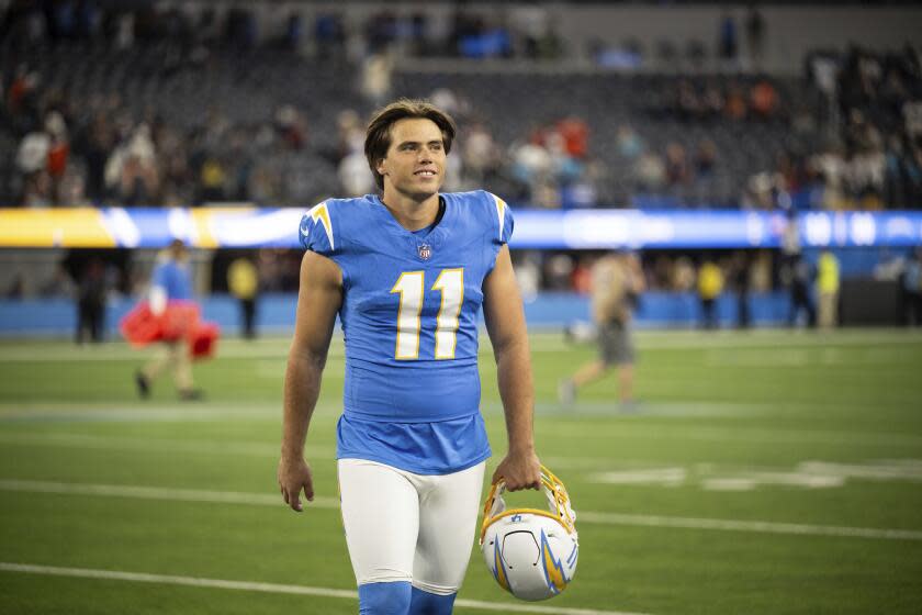 Los Angeles Chargers place kicker Cameron Dicker (11) walks back to the locker room after an NFL football game