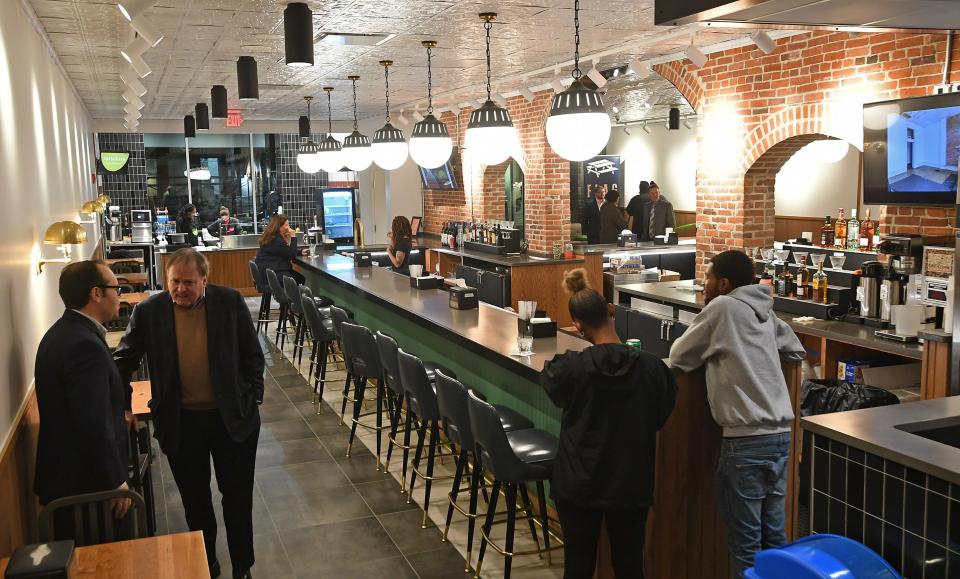 The new Perry's Tavern bar is shown during a VIP event, held Thursday, at the Flagship City Food Hall in downtown Erie. The bar is in the same location as the bar at the former Sherlock's, which once occupied this space. The newly renovated space with nine food vendors was set to open to the public on Monday.