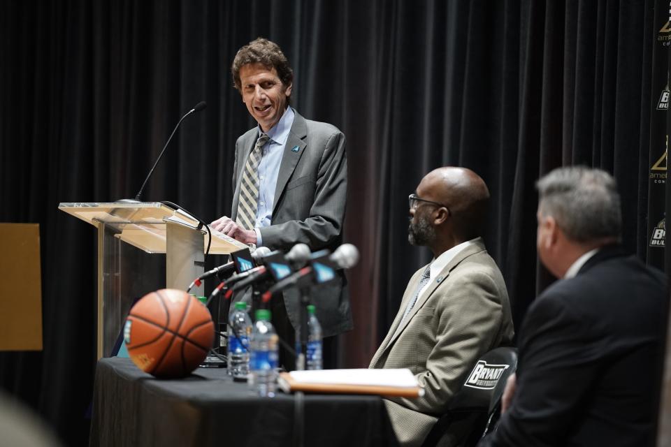 Bryant president Ross Gittell speaks at Wednesday's press conference. Seated at the table, America East commissioner Brad Walker and Bryant athletic director Bill Smith look on.