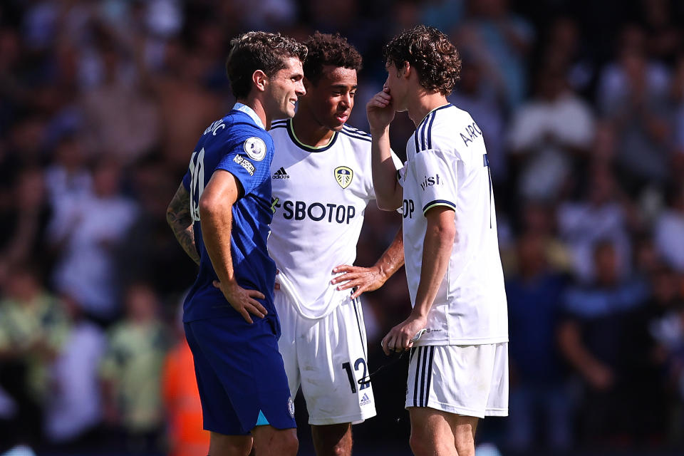 LEEDS, ENGLAND - AUGUST 21: Christian Pulisic of Chelsea with Tyler Adams and Brendan Aaronson of Leeds United at full time  during the Premier League match between Leeds United and Chelsea FC at Elland Road on August 21, 2022 in Leeds, United Kingdom. (Photo by Robbie Jay Barratt - AMA/Getty Images)