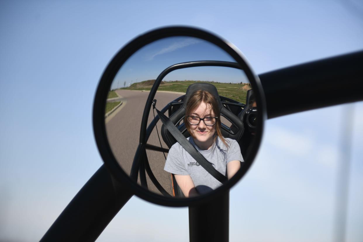 Harrisburg senior Riley Brewer, 18, drives the electric car around the school’s parking lot on Wednesday, April 24, 2024, at Tiger Stripes Garage in Harrisburg.