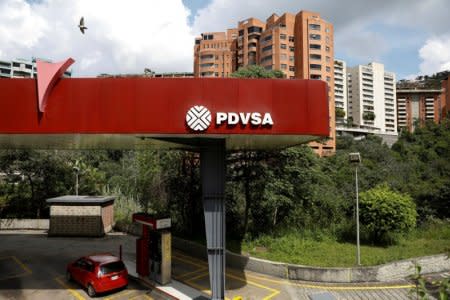 FILE PHOTO: The corporate logo of the state oil company PDVSA is seen at a gas station in Caracas, Venezuela November 16, 2017. REUTERS/Marco Bello/File Photo