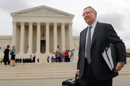 Attorney Carter Phillips of the Sidley Austin firm representing Mylan Inc. in the case of Teva Pharmaceuticals USA v. Sandoz, departs after arguments at the U.S. Supreme Court in Washington October 15, 2014. REUTERS/Jonathan Ernst