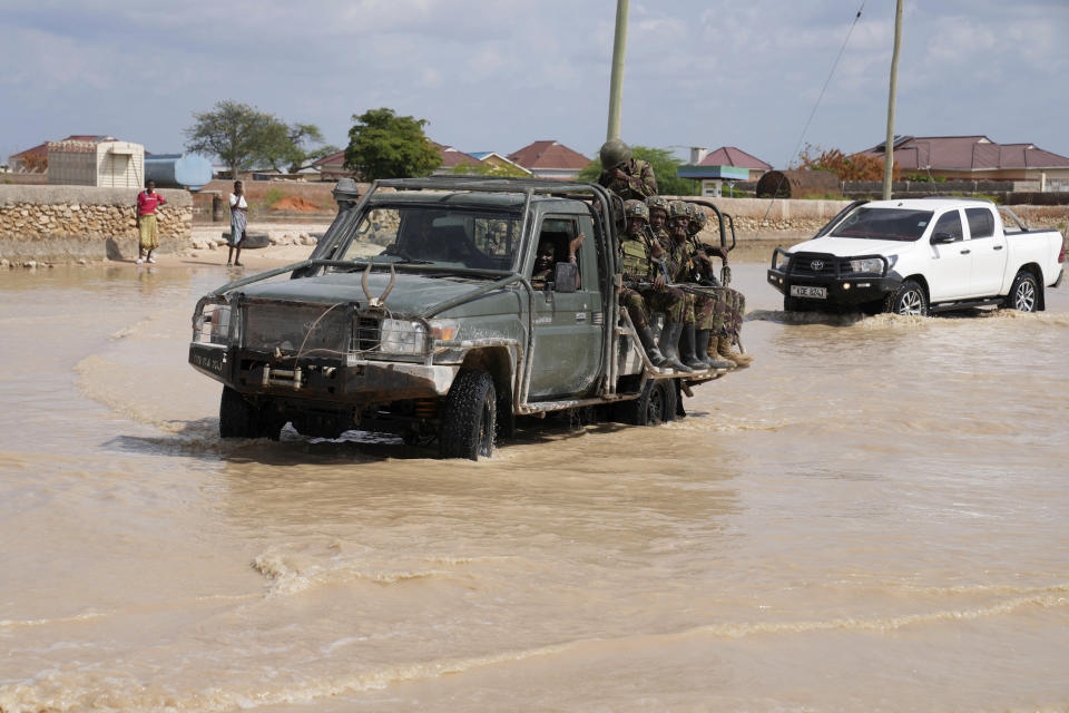 Kenya Army vehicle patrols the flooded streets of Mandera County, Kenya, Wednesday, Dec. 13, 2023. (AP Photo/Brian Inganga)