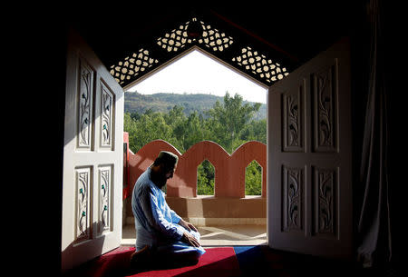 A man prays at the Al-Nadwa Madrassa in Murree, Pakistan, October 24, 2017. REUTERS/Caren Firouz