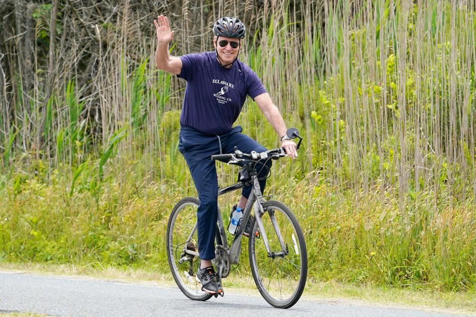 President Joe Biden, with first lady Jill Biden, not shown, takes a bike ride in Rehoboth Beach, Del., Thursday, June 3, 2021. The Biden's are spending a few days in Rehoboth Beach to celebrate first lady Jill Biden's 70th birthday