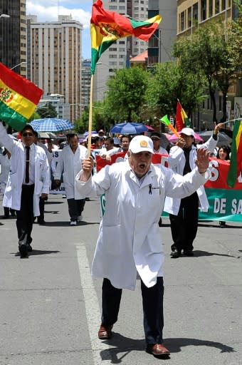 Health workers demonstrate outside the headquarters of Supreme Electoral Tribunal as counting continued in Bolivia's presidential elections