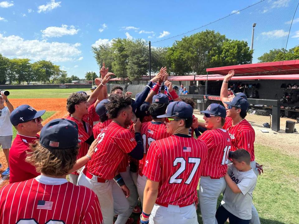 Westminster Academy baseball players celebrate after their 9-4 win over defending Class 2A state baseball champion Miami Christian on Tuesday.