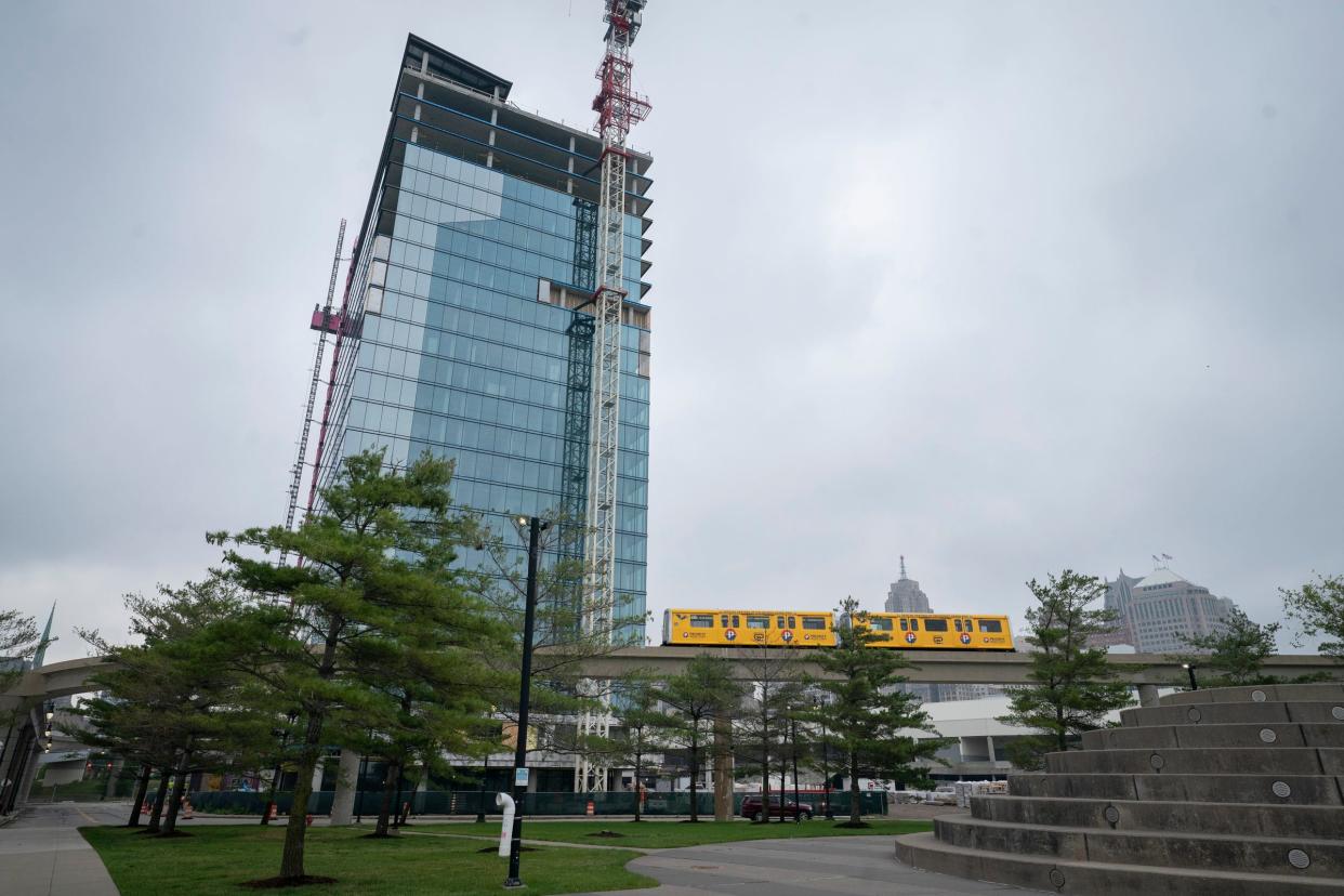 The People Mover cruises by The Residences at Water Square on the former site of the Joe Louis Arena on Tuesday, June 27, 2023.