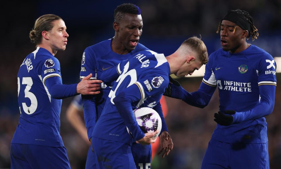 <span>Nicolas Jackson (centre) and Noni Madueke (right) remonstrate with Cole Palmer as he gets set to take the penalty that made it 5-0 to Chelsea.</span><span>Photograph: Alex Pantling/Getty Images</span>