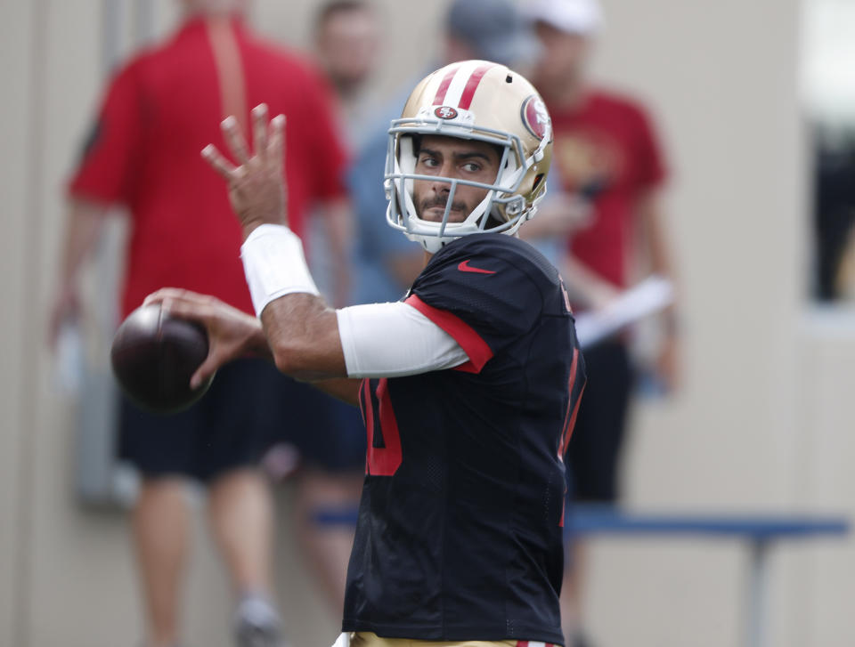 San Francisco 49ers quarterback Jimmy Garoppolo throws a pass during a combined NFL football training camp with the Denver Broncos at the Broncos' headquarters Friday, Aug. 16, 2019, in Englewood, Colo. (AP Photo/David Zalubowski)