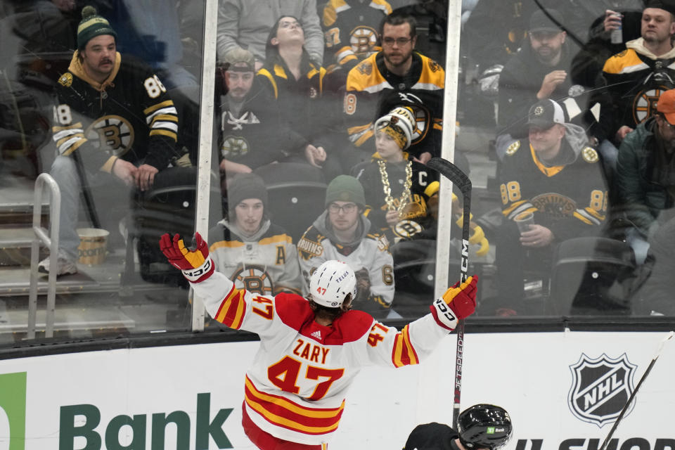 Calgary Flames center Connor Zary (47) celebrates after his goal as Boston Bruins watch during the first period of an NHL hockey game, Tuesday, Feb. 6, 2024, in Boston. (AP Photo/Charles Krupa)
