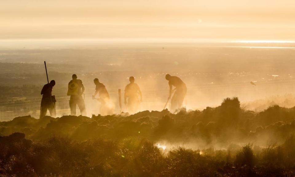 Winter Hill wildfire, near Bolton in Lancashire. ‘Anyone who read the news’ could see mounting evidence of the effects of climate change, Lord Deben said. 