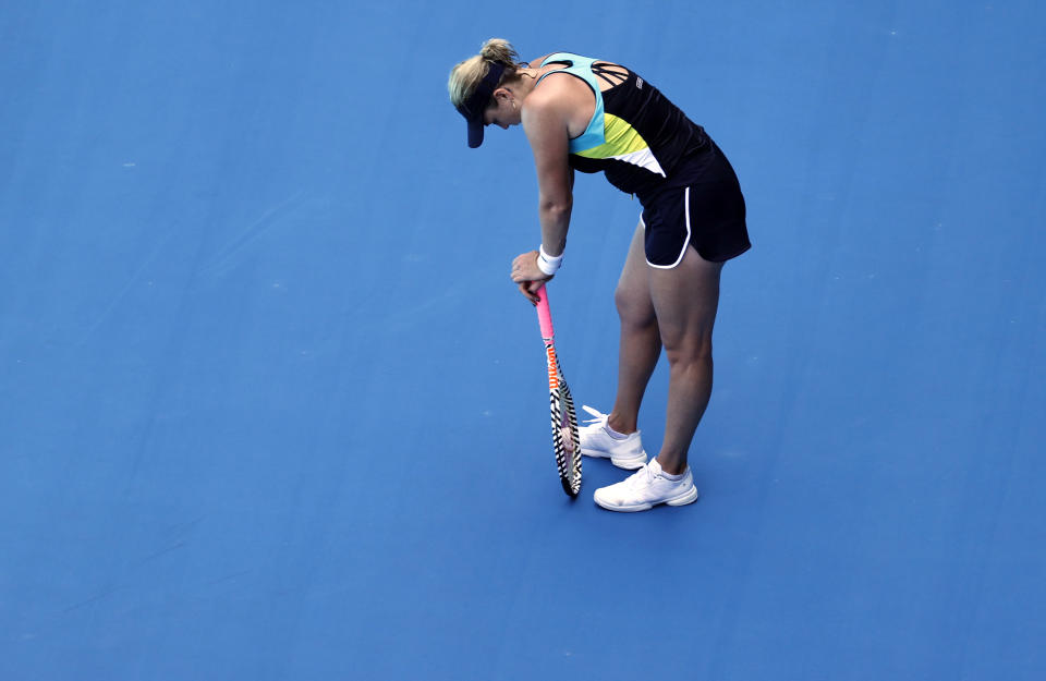 Russia's Anastasia Pavlyuchenkova rests on her racket during her quarterfinal match against Spain's Garbine Muguruza at the Australian Open tennis championship in Melbourne, Australia, Wednesday, Jan. 29, 2020. (AP Photo/Dita Alangkara)