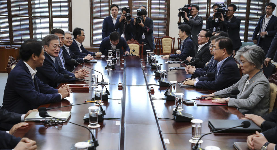 South Korean President Moon Jae-in, second from left, presides over a meeting with his security ministers, including National Security Advisor Chung Eui-yong, second from right, and National Intelligence Service Director Suh Hoon, third from right, one day before Chung and Suh make a one-day trip to North Korea at the presidential Blue House in Seoul, South Korea, Tuesday, Sept. 4, 2018. A South Korean presidential delegation on Wednesday, Sept. 5, plans to leave for North Korea for talks to arrange a summit planned later this month and rescue a faltering nuclear diplomacy between Washington and Pyongyang. (Hwang Gwang-mo/Yonhap via AP)