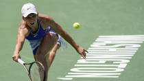 Romania's Simona Halep returns during a first round match against Spain's Cristina Bucsa at the Citi Open tennis tournament in Washington, Monday, Aug. 1, 2022. (AP Photo/Carolyn Kaster)