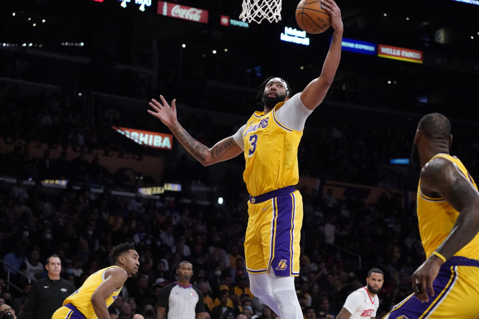 Los Angeles Lakers forward Anthony Davis (3) grabs a rebound during the second half of an NBA basketball game against the Houston Rockets Tuesday, Nov. 2, 2021, in Los Angeles. (AP Photo/Marcio Jose Sanchez)