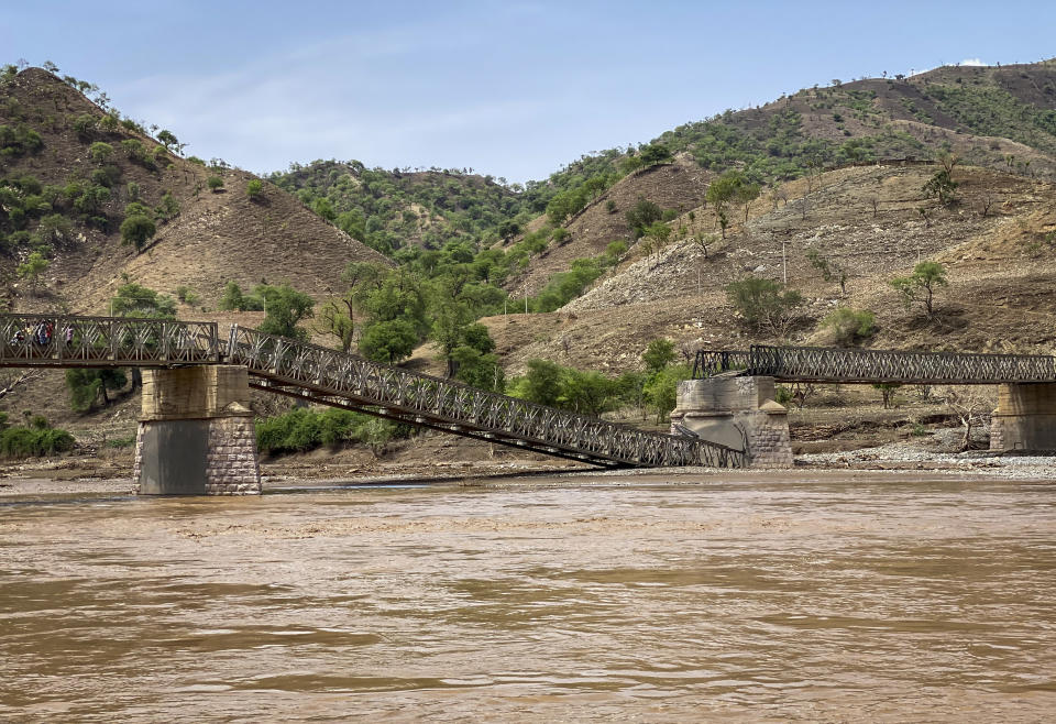A destroyed bridge crossing the Tekeze River is seen in the Tigray region of northern Ethiopia Thursday, July 1, 2021. The bridge that is crucial to delivering desperately needed food to much of Ethiopia's embattled Tigray region has been destroyed, aid groups said Thursday. (Roger Sandberg/Medical Teams International via AP)