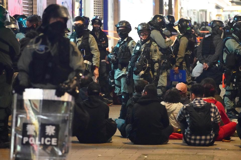 Police detain protesters in Hong Kong, Wednesday, Jan. 1, 2020. Hong Kong toned down its New Year’s celebrations amid the protests that began in June and which have dealt severe blows to the city’s retail, tourism and nightlife sectors. (AP Photo/Vincent Yu)