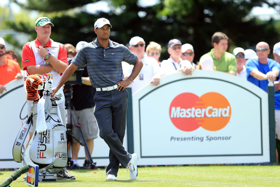 ORLANDO, FL - MARCH 24: Tiger Woods of the USA waits on the tee with his caddie Joe LaCava to play his tee shot at the par 3, second hole during the third round of the 2012 Arnold Palmer Invitational presented by MasterCard at Bay Hill Club and Lodge on March 24, 2012 in Orlando, Florida. (Photo by David Cannon/Getty Images)