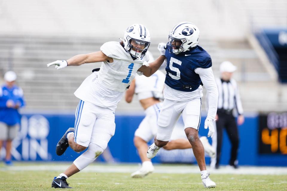 BYU Cougars wide receiver Keanu Hill (1) runs a route against Cougars defensive back D’Angelo Mandell (5) during the annual BYU Blue vs. White scrimmage at LaVell Edwards Stadium in Provo on Friday, March 31, 2023. | Ryan Sun, Deseret News