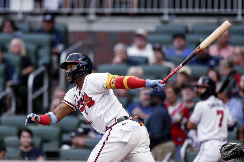 Atlanta Braves' Ronald Acuña Jr. hits a single against the Arizona Diamondbacks during the first inning of a baseball game Saturday, July 30, 2022, in Atlanta. (AP Photo/Butch Dill)