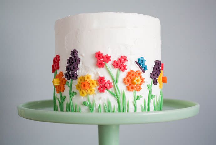 <p>Turn the sides of your cake into a garden with slices of <a href="https://www.amazon.com/TWIZZLERS-Twists-Rainbow-12-4-Ounce-Bags/dp/B0029JU0ZU?tag=syn-yahoo-20&ascsubtag=%5Bartid%7C10050.g.531%5Bsrc%7Cyahoo-us" rel="nofollow noopener" target="_blank" data-ylk="slk:rainbow Twizzlers;elm:context_link;itc:0;sec:content-canvas" class="link ">rainbow Twizzlers</a> arranged into flower shapes.</p><p><strong>Get the recipe at <a href="http://www.handmadecharlotte.com/twizzler-flower-toppers-for-the-perfect-spring-cake/" rel="nofollow noopener" target="_blank" data-ylk="slk:Handmade Charlotte;elm:context_link;itc:0;sec:content-canvas" class="link ">Handmade Charlotte</a>.</strong></p>