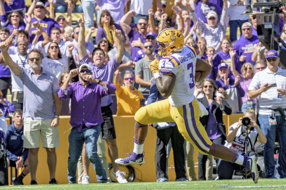 LSU running back Tyrion Davis-Price (3) runs for a touchdown in the first half of an NCAA college football game against Florida in Baton Rouge, La., Saturday, Oct. 16, 2021. (AP Photo/Matthew Hinton)