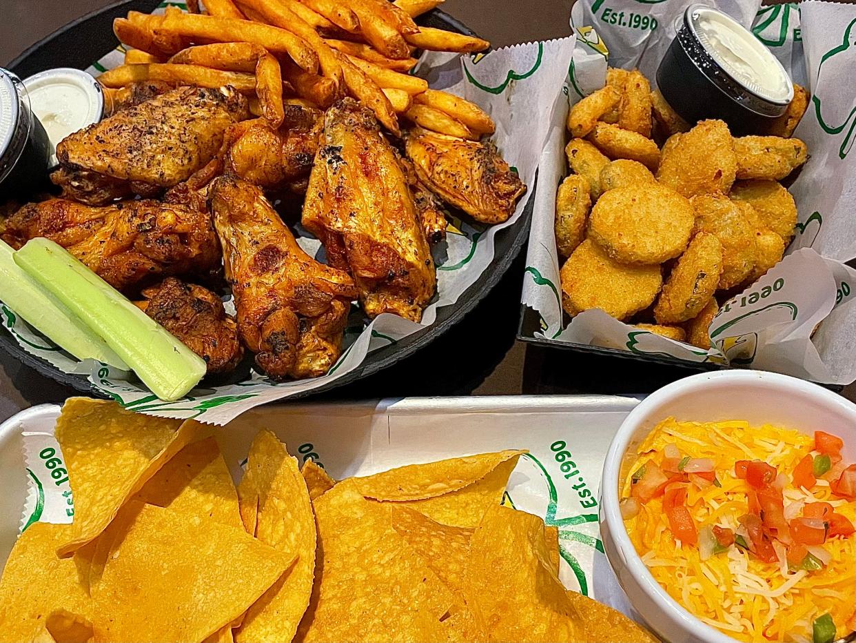 Mild Wally Wings, Buffalo chicken dip and fried pickle chips from Houligan's.