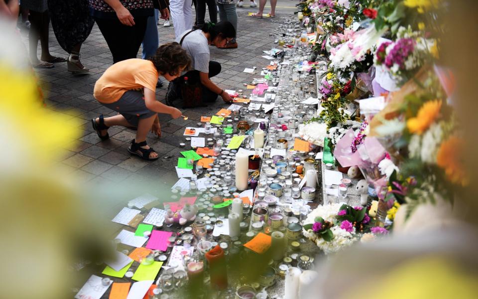 Floral tributes close to Grenfell Tower - Credit: Andy Rain/EPA