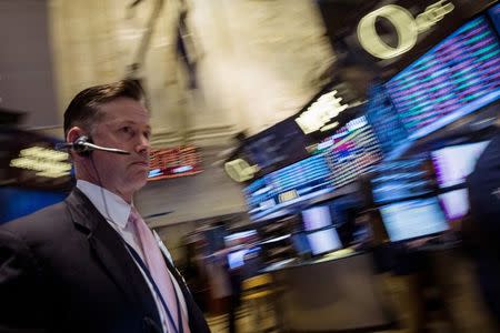 A trader works on the floor of the New York Stock Exchange July 17, 2014. REUTERS/Brendan McDermid