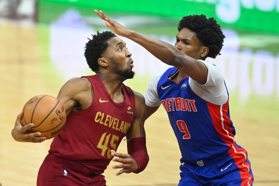 Cavaliers guard Donovan Mitchell drives against Pistons forward Ausar Thompson in the first quarter Wednesday in Cleveland.