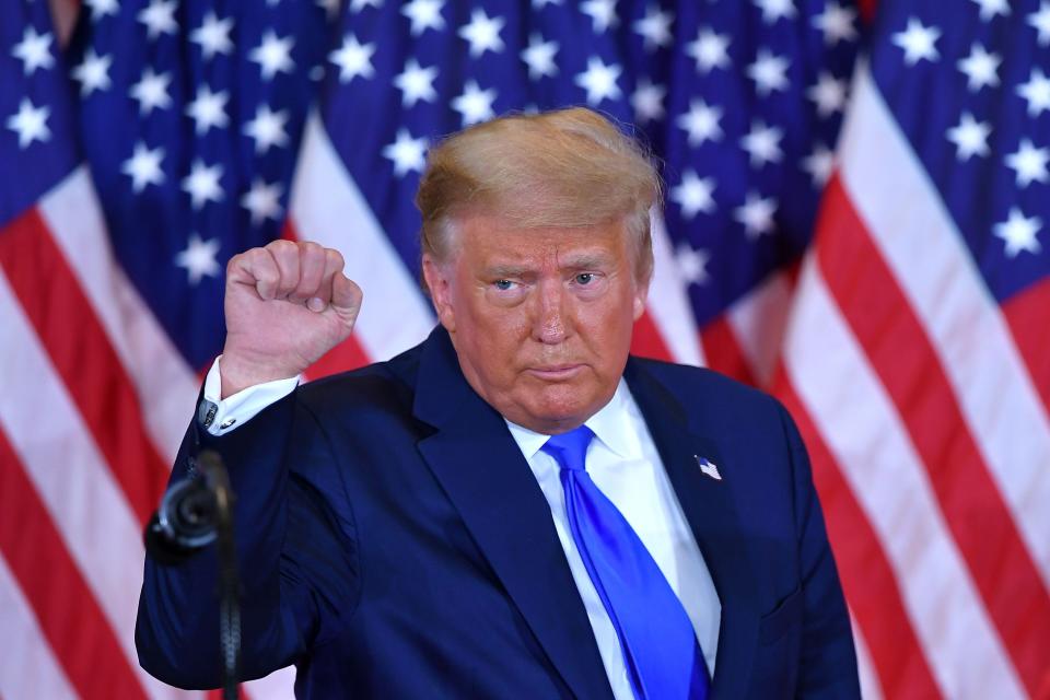 US President Donald Trump pumps his fist after speaking during election night in the East Room of the White House in Washington, DC, early on November 4, 2020.