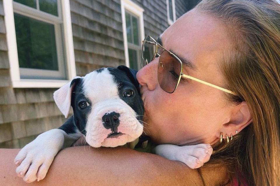 <p>Brooke Shields/Instagram</p> Brooke Shields gives her puppy Tuzi a kiss. 