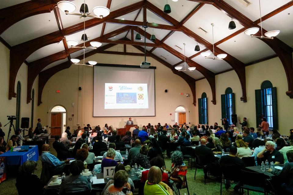 Attendees listen as Columbus Mayor Andrew J. Ginther and other city officials host a community discussion about gun violence on Tuesday, Sept. 19, 2023 at Columbus Public Health.