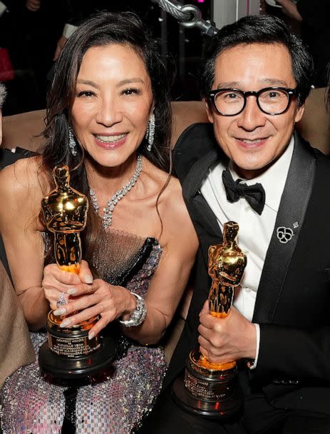 PHOTO: Michelle Yeoh and Ke Huy Quan hold their Oscars while attending the 2023 Vanity Fair Oscar Party, Mar. 12, 2023 in Los Angeles. (Kevin Mazur/WireImage via Getty Images)