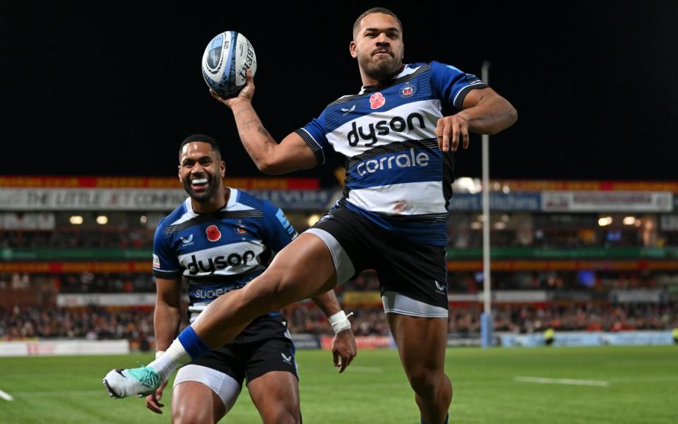 Ollie Lawrence celebrates scoring a try for Bath