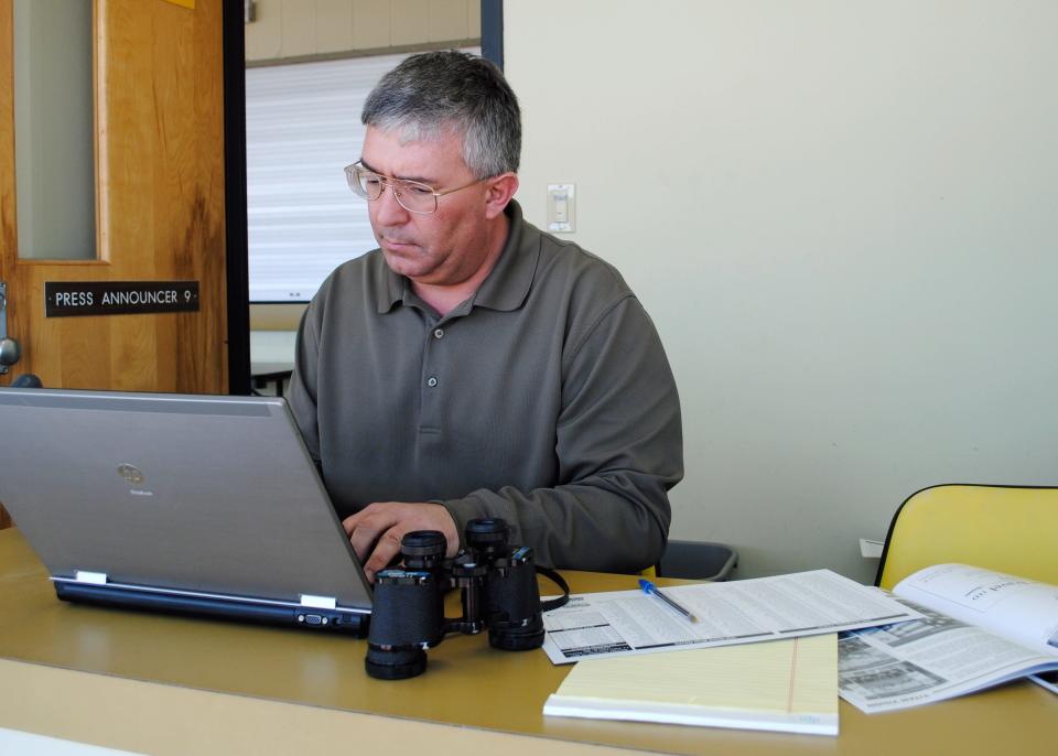 SID Kennan Timm enters statistics during a UW-Oshkosh football game.