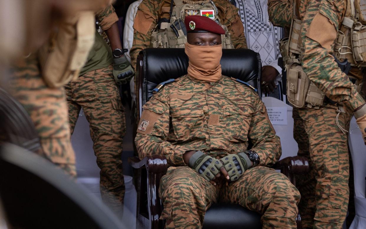 Burkina Faso's ruler Capt Ibrahim Traore attends a ceremony in military fatigues