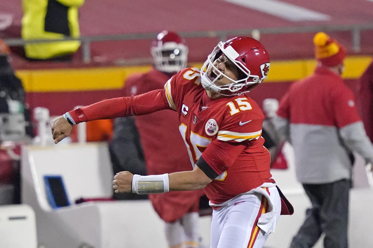 Kansas City Chiefs quarterback Patrick Mahomes celebrates after throwing a 5-yard touchdown pass to tight end Travis Kelce in the Chiefs' AFC championship game win. (AP Photo/Jeff Roberson)