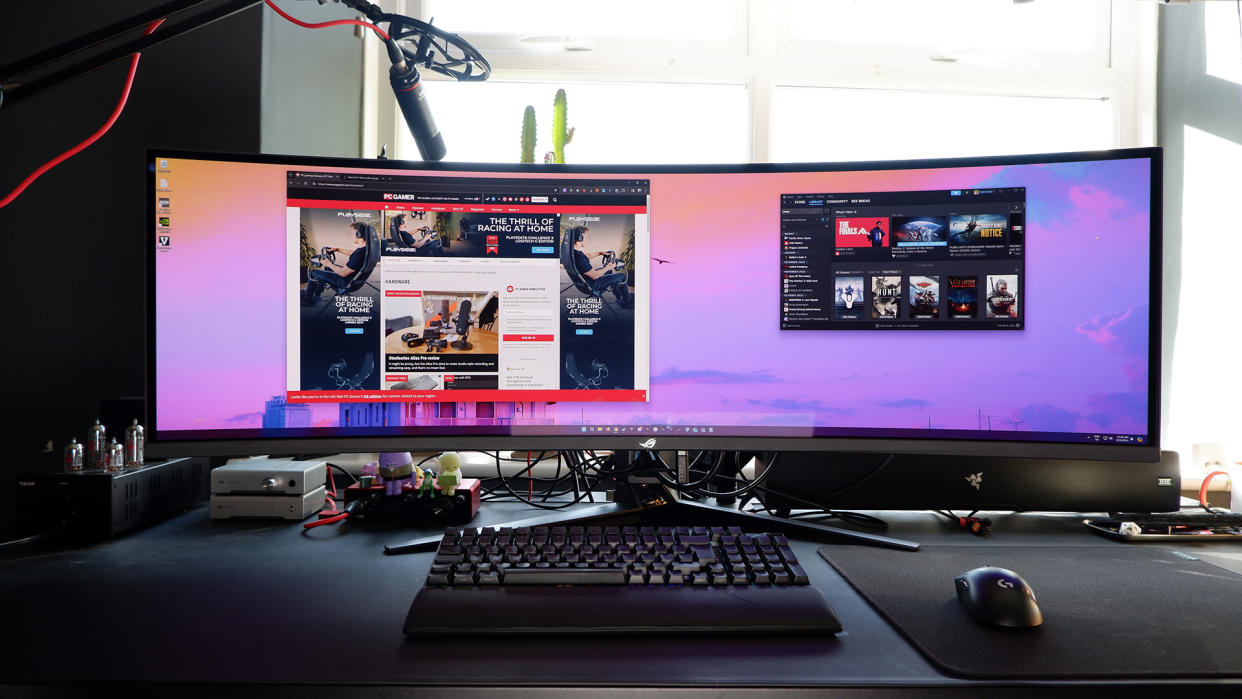  The Asus ROG Swift OLED PG49WCD set up on a gaming desk. 