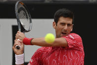 Serbia's Novak Đjoković returns the ball to Argentina's Diego Sebastián Schwartzman during their final match at the Italian Open tennis tournament, in Rome, Monday, Sept. 21, 2020. (Alfredo Falcone/LaPresse via AP)