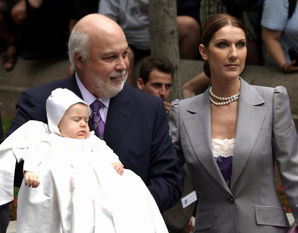 MONTREAL, CANADA:  Canadian pop singer Celine Dion and her husband Rene Angelil show off their baby Rene-Charles as they take him to his baptism at the Notre Dame Basilica 25 July in Montreal, Canada. Nearly 2,000 fans had gathered in the square in front of the 170-year-old church, in Montreal's picturesque old quarter.  AFP PHOTO/Marcos TOWNSEND (Photo credit should read MARCOS TOWNSEND/AFP/Getty Images)