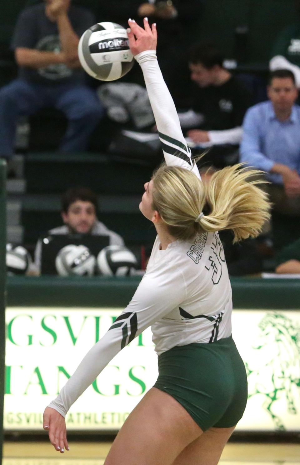 Maddie Heiser of Central Catholic goes of a kill attempt during their DIV regional semifinal against Monroeville at Strongsville on Thursday, Nov. 3, 2022. 