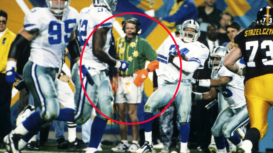 The man, pictured here on the sideline as Larry Brown celebrates his touchdown in the 1996 Super Bowl.