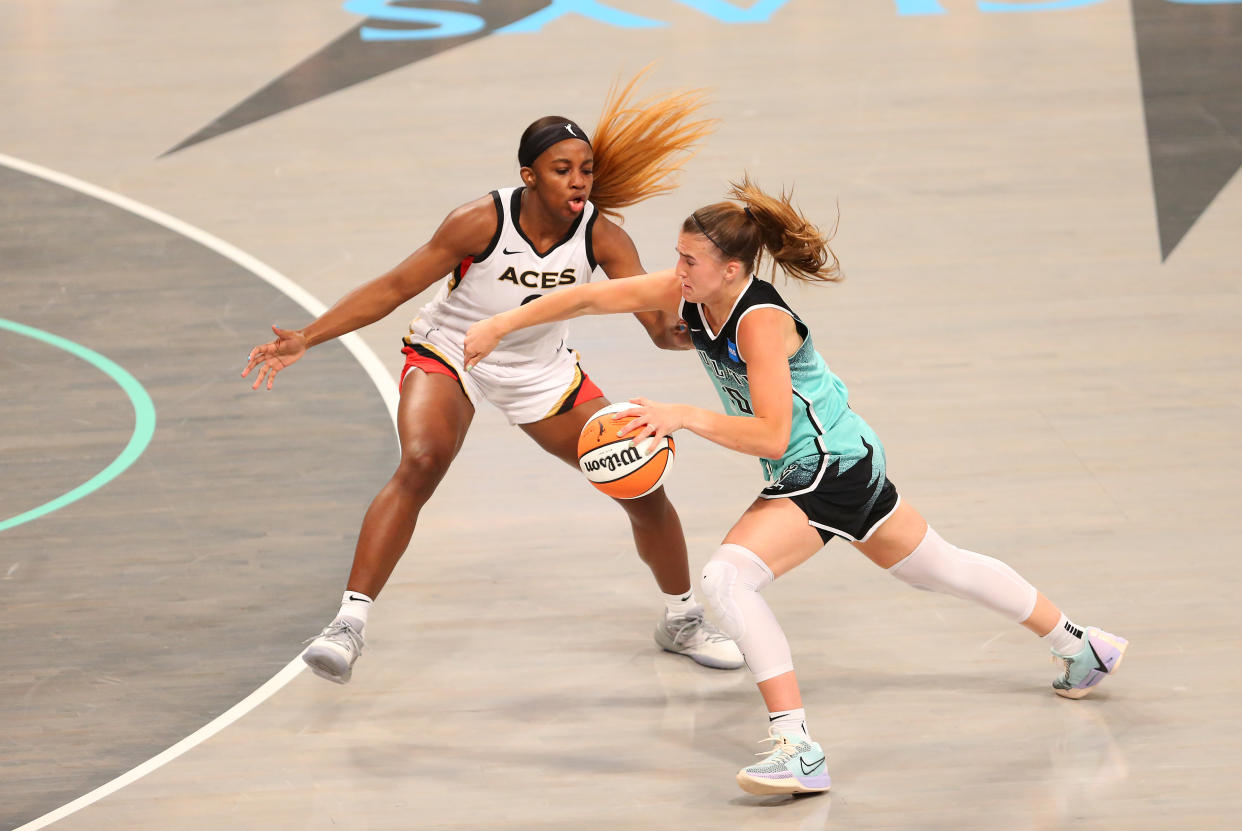 New York Liberty guard Sabrina Ionescu is defended by Las Vegas Aces guard Jackie Young on Aug.  6, 2023, at Barclays Center in New York. (M. Anthony Nesmith/Icon Sportswire via Getty Images)