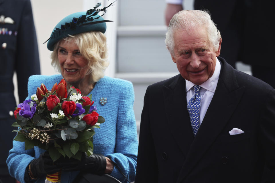 Britain's King Charles III and Camilla, the Queen Consort, arrive at the airport in Berlin, Wednesday, March 29, 2023. King Charles III arrives Wednesday for a three-day official visit to Germany. (Jens Buettner/dpa via AP)