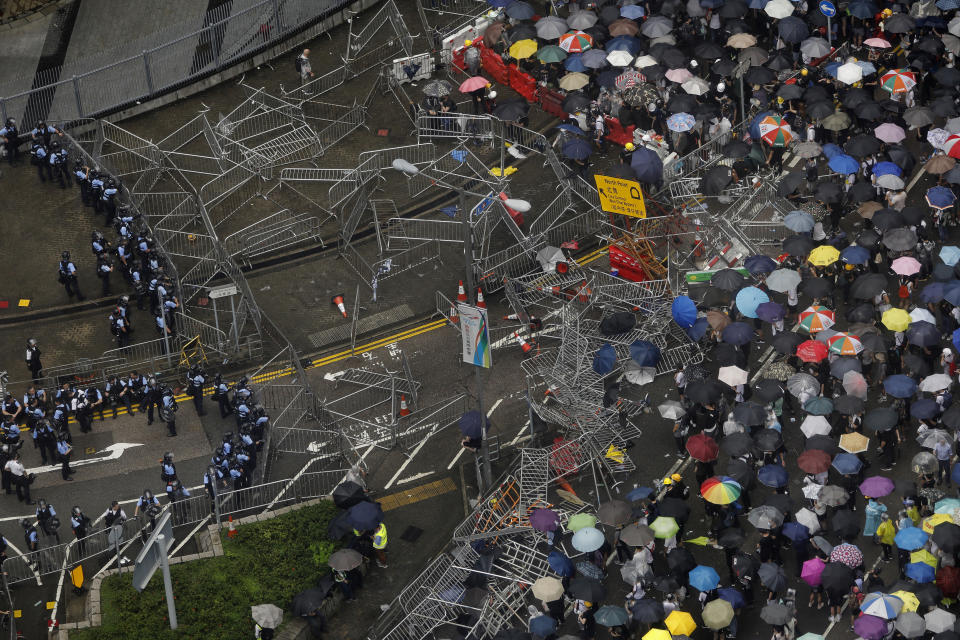 Protesters gather outside the Legislative Council in Hong Kong, Wednesday, June 12, 2019. Thousands of protesters blocked entry to Hong Kong's government headquarters Wednesday, delaying a legislative session on a proposed extradition bill that has heightened fears over greater Chinese control and erosion of civil liberties in the semiautonomous territory. (AP Photo/Vincent Yu)